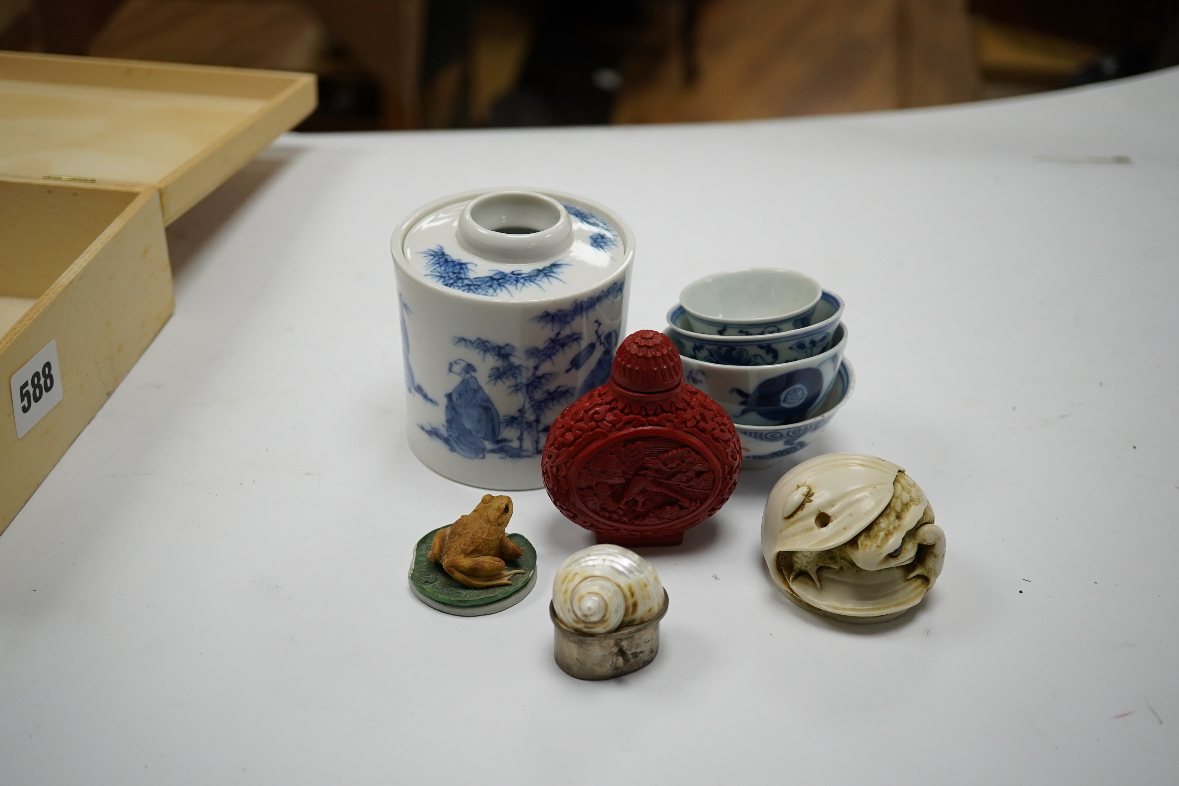 A Japanese blue and white seven sages of the bamboo grove joss-stick holder, 9.5cm high, four Chinese blue and white bowls, 19th/20th century and four other miscellaneous items. Condition - fair to good